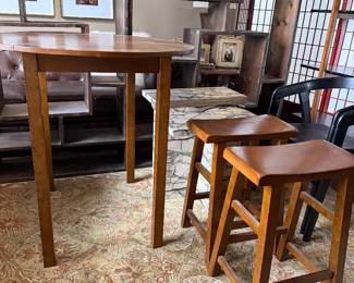 Real wood table with two stools and glass top