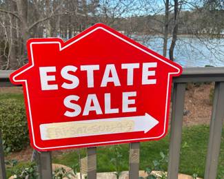 Look for these signs to guide you to the entrance at the lower level of the house 