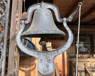 nice cast iron dinner bell on post