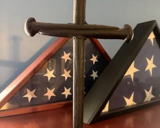 cast iron cross, flags with flag cases