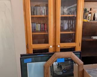 Wood Media Cabinet & Mirrors: Light wood glass-front media cabinet perfect for CDs or collectibles, plus framed wall mirrors.