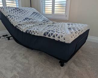 Premium Adjustable Bed: Mattress Firm twin adjustable bed equipped with an "Ease" base for head and foot tilt. Like new (only 1 year old), includes manual, and originally retailed for roughly $1,800!