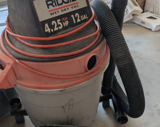 Ridgid Shop Vac: Heavy-duty Ridgid 12-gallon, 4.25 peak HP Wet/Dry shop vacuum with hose and floor attachments.