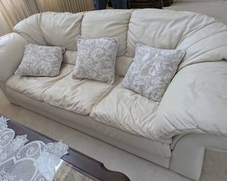 White Leather Sofa: Plush, comfortable white leather sofa in great condition.