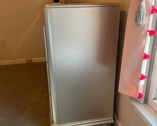 P11 - $150. 6 Drawer Dresser in Silver with mirror accents. All drawers slide easily. No name. Measures 64" wide x 17" deep x 35.5" tall.