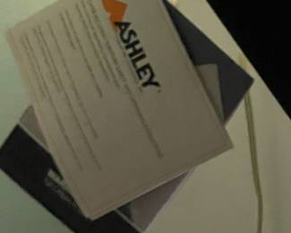 P32 - $350. White Headboard with Adjustable Queen Bed. Frame & Mattress are from Ashley Furniture. Works great!