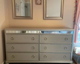 P11 - $150. 6 Drawer Dresser in Silver with mirror accents. All drawers slide easily. No name. Measures 64" wide x 17" deep x 35.5" tall.
