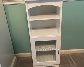 P31 - $25. Small Storage Cabinet with shelves and a door. Measures 14” wide x 10.5” deep x 34" tall.