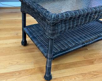 P87 - $40. Glass Top Coffee Table with indoor/outdoor plastic wicker look. Measures 30" x 17" x 17.5". 