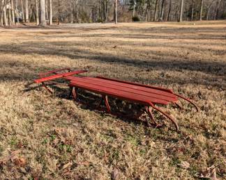 P107 - $30. Red Wooden Sled with Metal Rails. 
