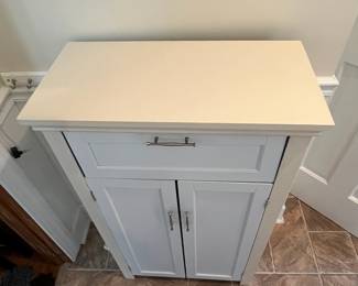 P23 - $25. Small Storage Cabinet - Drawer needs repair. Was used in the kitchen for storage. Measures 23.75” wide x 12” deep x 39.25” tall.