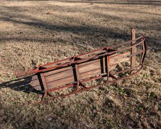 P107 - $30. Red Wooden Sled with Metal Rails. 