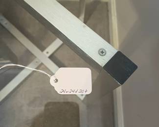 P15 - $40. Single Silver Framed Side Table with Glass Top. Was used next to a bed. Measures 24” wide x 24” deep x 20” tall.