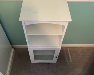P31 - $25. Small Storage Cabinet with shelves and a door. Measures 14” wide x 10.5” deep x 34" tall.