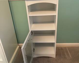 P31 - $25. Small Storage Cabinet with shelves and a door. Measures 14” wide x 10.5” deep x 34" tall.