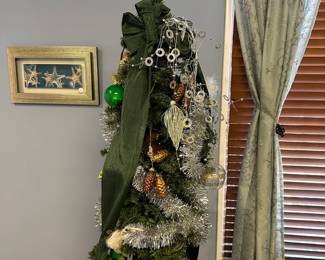 P71 - $30. 6' tall Skinny Tree with Ornaments. 
