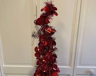 P72 - $20. Tall Red  Wiggle Tree. 