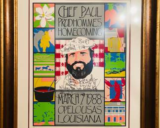 Numbered & Signed by Both Chef Paul Prudhomme & Artist, Susan Voitier. This 1988 Chef Paul Prudhomme Homecoming is Beautifully Framed & Matted 