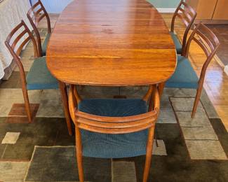 MCM Teak Extension Rounded Rectangular Dining Table with Hidden Leaf Storage (40"W x 28-1/2"H x 67-1/2"L with 2 - 15"L Additional Leaves) & Mobelfabrik Denmark Model 78 "Horned" Teak Dining Chairs with Linen Upholstered Seats Designed by Niels Otto Møller (19-1/2"W x 19-1/2"D x 31-1/2" Back Height) 2 Armchairs / 4 Side Chairs  