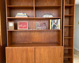 Vintage Teak Modular Bookshelves (Top- 12"D x 54-1/2"W x 50-1/2"H) with Hundevad & Co. Teak Lower Dual Sliding Door Cabinet (Lower - 17"D x 54-1/2"W x 26-1/2"H) & Teak 6 Tier Skinny Bookshelf (Right - 12"D x 10-1/2"W x 77"H)