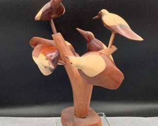 Carved birds on tree