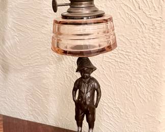 Antique figural oil lamp