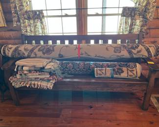 There is a nice bench under those rugs