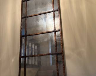 large mirror - hanging in stairwell