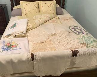 Needle point tablecloths, handmade dollies