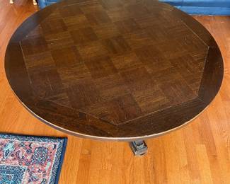 Round coffee table with raise and lower lever