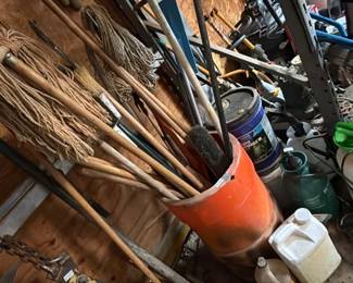 PLASTIC BARREL WITH BROOMS , MOP , ETC