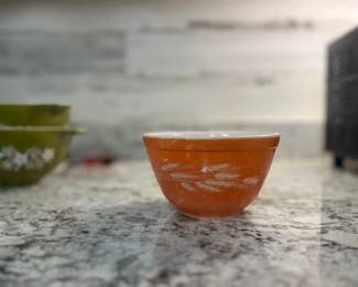 vintage Pyrex mixing bowl in the "Autumn Harvest Wheat" pattern, manufactured in the 1970s.