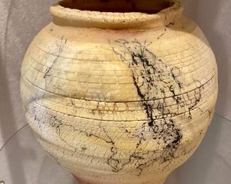 Raku pottery vase feature a distinctive horse hair decorative technique