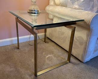 One of a pair of brass and glass mid century end tables 