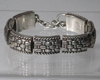 .925 Sterling Heavy Designer Bracelet approx .50" wide with repeating design it is 7" long ending in toggle clasp, 40.3 grams total weight, bracelet is happmarked .925 and with initials that are unreadible, very nice piece