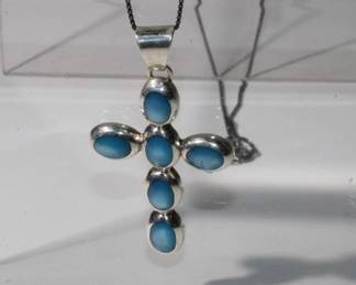 .925 Sterling Silver Cross Pendant on .925 Chain Cross features 6 oval blue opalascent gems and measures approx. 2" long and jus tover 1" wide is hallmarked .925 TN-47, chain measures approx 20" long, 7.8 grams total weight