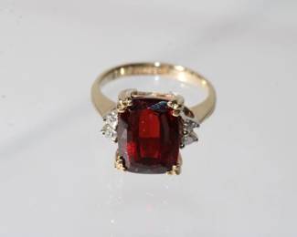 14kt yellow gold Tourmaline & Diamond Ring that features a beautiful approx 2.5ct emerald cut rubilite tourmaline with deep red color with two round diamonds on each side, size 4, 4.1 grams total weight