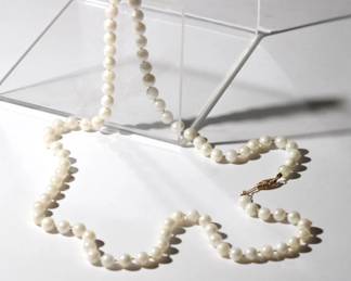 14kt yellow gold and pearl Necklace the pearls measure 6.4 to 6.5mm and are 24" long with 14kt yellow gold clasp and come in pouch from jewelry store