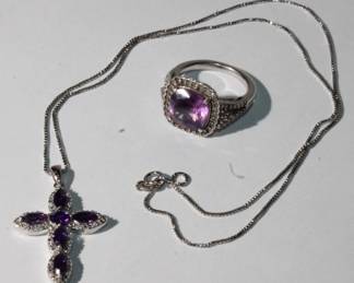 .925 Sterling Silver Amethyst Ring and Cross Pendant suite, Cross is approx 1.25" long and .75" wide on 18" sterling silver chain, ring features approx 2ct prong set princess cut amethyst and is a size 7, total weight of suite is 10.8 grams