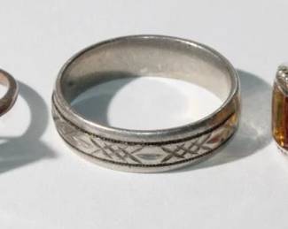 3 - .925 Sterling Rings; 1 - multi colored emerald cut gems, 2 - band ring, 3 large clear emerald cut gem, sizes 7 to 10, 15.7 grams total weight, all for one money