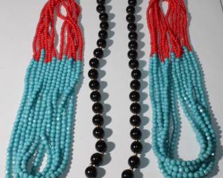 14kt yellow gold and Black Bead and small 14kt yellow gold bead Necklace along with two sets of red and blue beads with six strands in each set, ready to be strung, all for one money, black beads have 14kt gold clasp