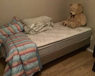 Twin bed with bedding