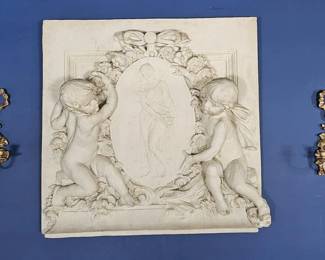 Large Louis XV style decorative wall plaque featuring putti holding a cameo, in high relief.