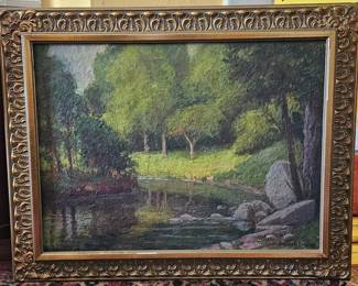 Francis Edgar Gates, New York (1863-1952). Oil on masonite, landscape with a stream. In carved wooden gilt frame.