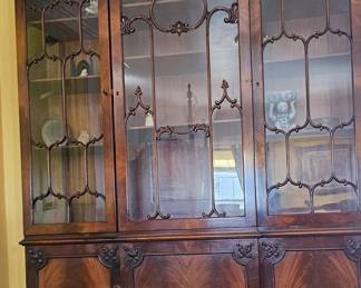 Antique Mahogany Georgian Style Breakfront / Bookcase. Featuring a classical broken arch crown and glass doors with intricate geometric mullions.