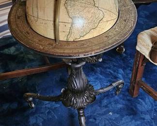 Early 20th century globe on a cast iron acanthus base.