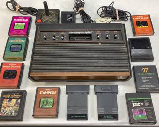 ATARI 2600 VIDEO COMPUTER SYSTEM, CONTROLLER, ASSORTED GAME CARTRIDGES STAMPEDE, MISSILE COMMAND, LASER BLAST