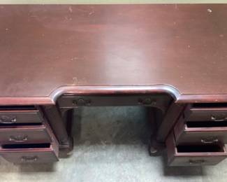 VTG. GEORGIAN MAHOGANY STYLE WRITING DESK WITH MCM STAKMORE CO. FOLDING CANE BACK CHAIR. DESK HAS DAMAGE AT FEET. NO SHIPPING PICKUP ONLY