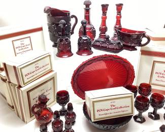 AVON THE 1876 CAPE COD COLLECTION RUBY RED GLASSWARE SET, FOOTED GLASSES, CANDLESTICK HOLDERS, DINNERWARE, PITCHER, DECANTER & STOPPER, BELLS, BUTTER DISH, 2-TIER SERVER, HEART TRINKET BOX NO SHIPPING PICKUP ONLY