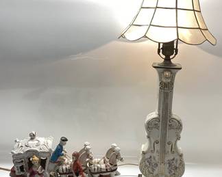 ANTIQUE GERMAN PORCELAIN THE PRINCE AND PRINCESS HORSE DRAWN CARRIAGE WITH A PORCELAIN VIOLIN LAMP AND SCALLOPED CAPIZ STYLE SHADE